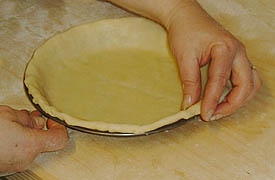 Folding the pie crust edge under itself